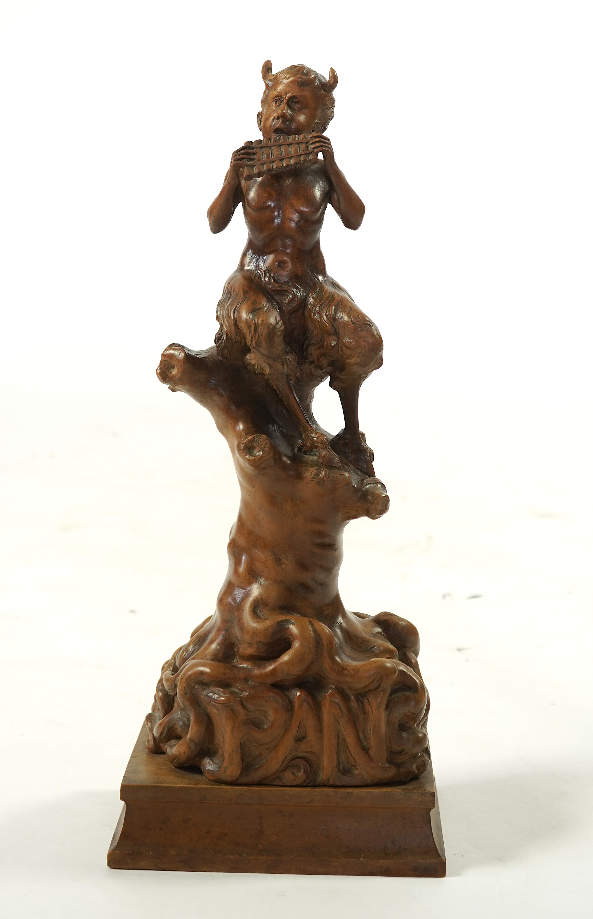 A late 19th century French carved walnut figure of Pan